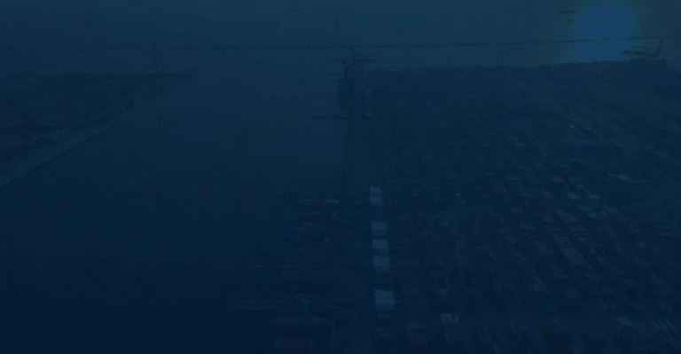A wide-angle shot of a container terminal with high-speed cargo being transferred to expedited vehicles for the final mile.