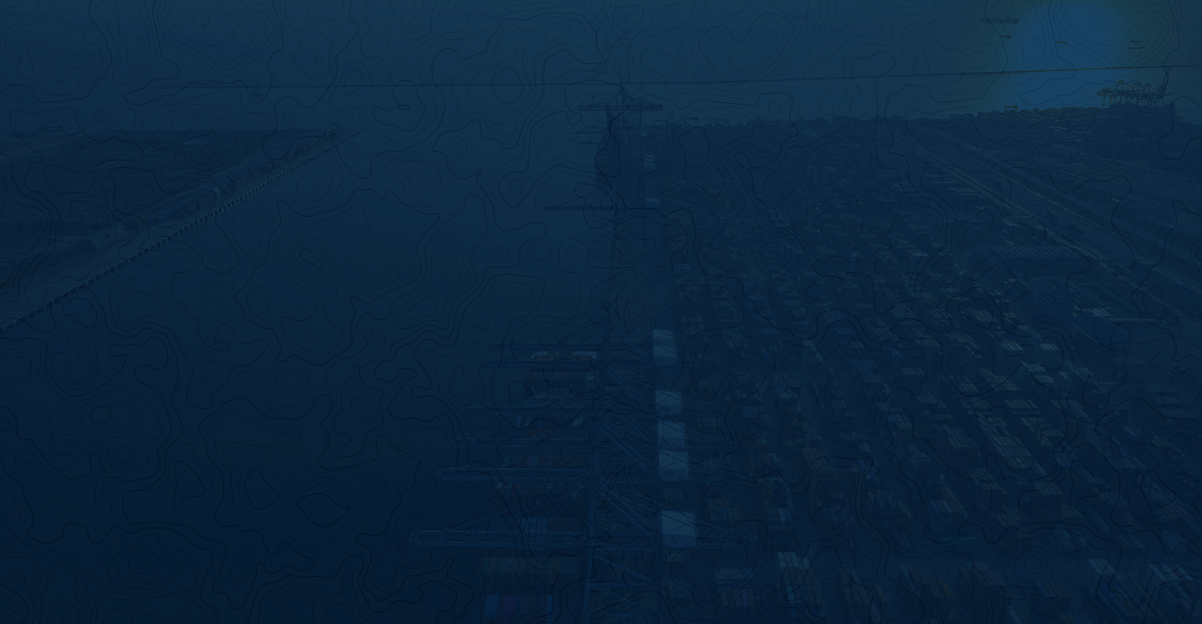 A wide-angle shot of a container terminal with high-speed cargo being transferred to expedited vehicles for the final mile.