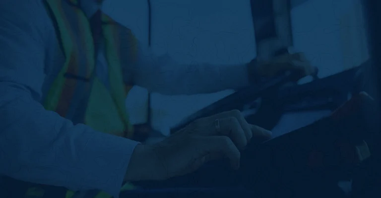 A professional truck driver using an Electronic Logging Device (ELD) to verify compliance data.