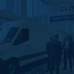 A professional presentation stage and networking area at a corporate logistics and supply chain conference.